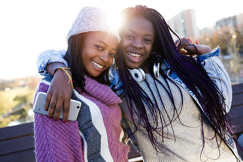 two-beautiful-young-woman-looking-camera-street.jpg