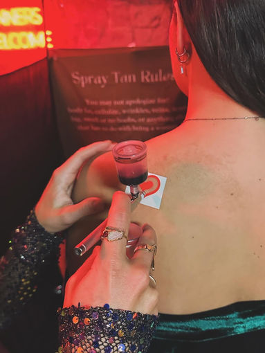 spray tan tattoos for women's event, tan tattoos, airbrush tan tattoos