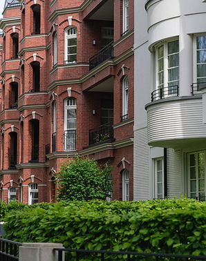 Modern and classic Western European apartment buildings lined with greenery.jpg