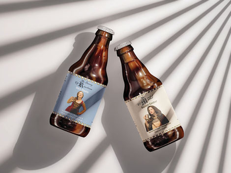 Two mocked up beer bottles with a living history theme with photography of a woman in medieval garb on the front and a decorative crenellation die line