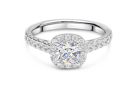 The Hampstead cushion cut halo engagement ring setting in white gold with four-claw low cathedral setting and diamond-set shoulders.