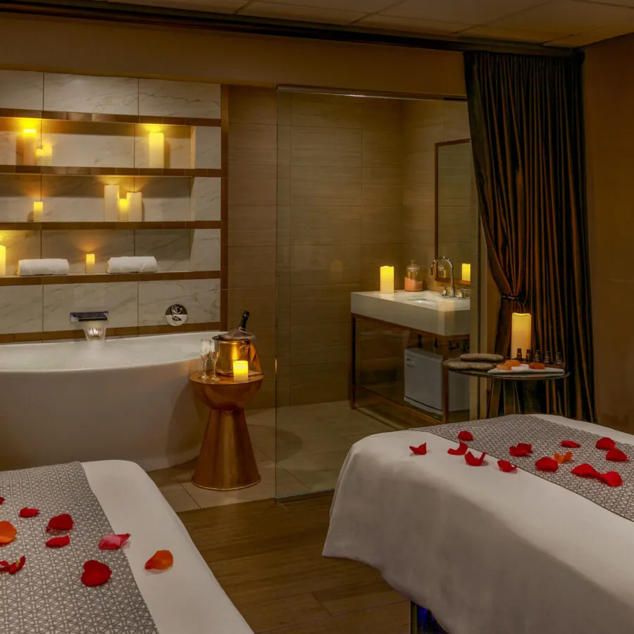 Inside Chateau Elan's day spa with massage beds adorned in rose petals