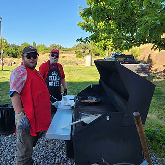 Lion Ethan Wray and Ed Goodman man the grill_edited.jpg