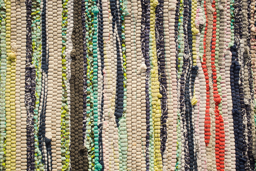 Hand weave fabric scraps into rugs