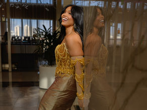 a beautiful woman smiling in an elegant dress of an elegant hotel lobby