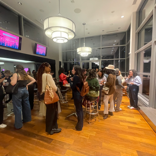 A group of female and non-binary filmmakers mingling.