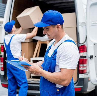 two-removal-company-workers-unloading-boxes-from-minibus-into-customers-home_edited.jpg