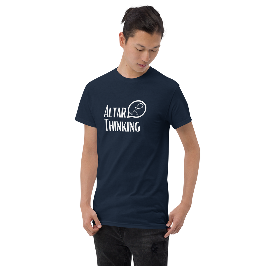Man modeling a navy blue t-shirt with the text ALTAR THINKING in white.