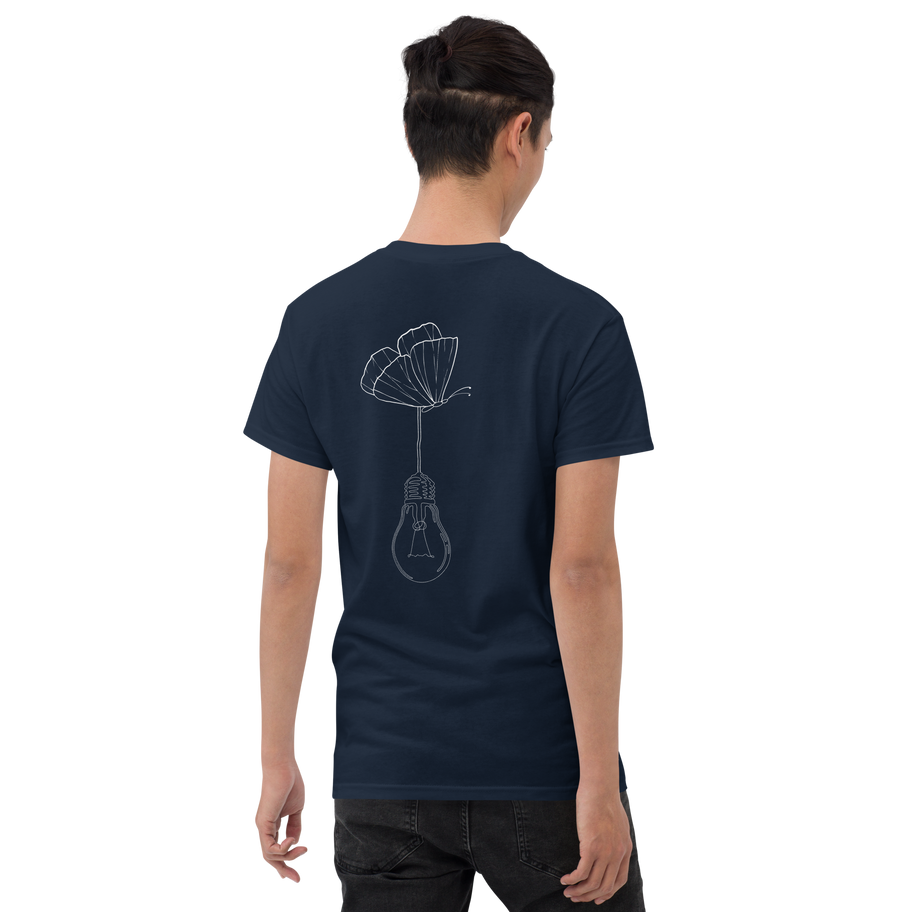 Man wearing dark blue t-shirt with a lightbulb flower design on back.