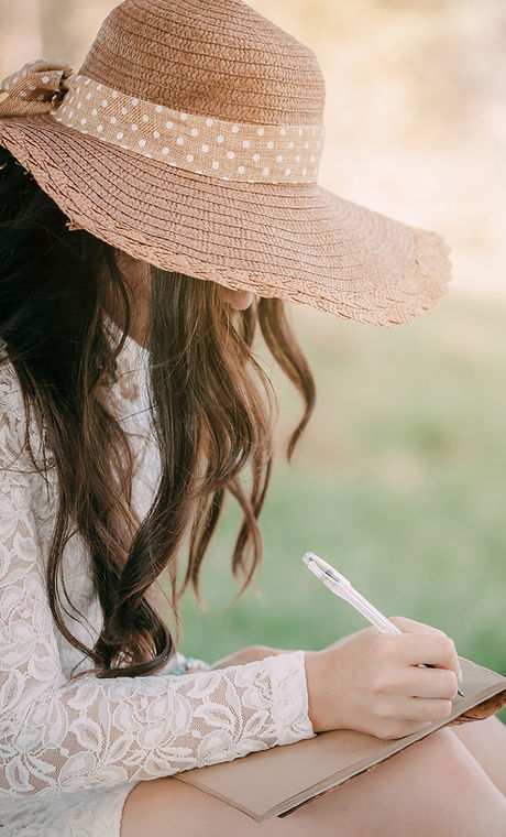 young woman in a straw hat with long hai
