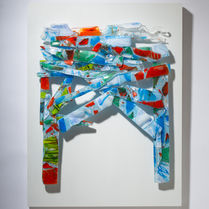 A multicoloured fused glass, wall based sculpture, resembling an archway, mounted on wood panel by Glass Artist in Oakland CA. For sale