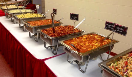 Hot catering dishes arranged in chafing dishes for buffet style event