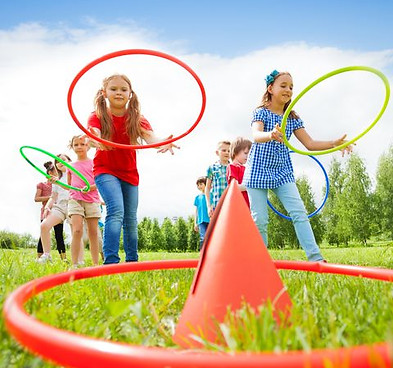 kids-throw-colorful-hoops-on-cones-while-competing-royalty-free-image-1619202250_.jpg