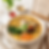 Ramen bowl with mushrooms, greens, carrots and chili on a bright table, with chopsticks and menu reading Authentic Asian Flavours.