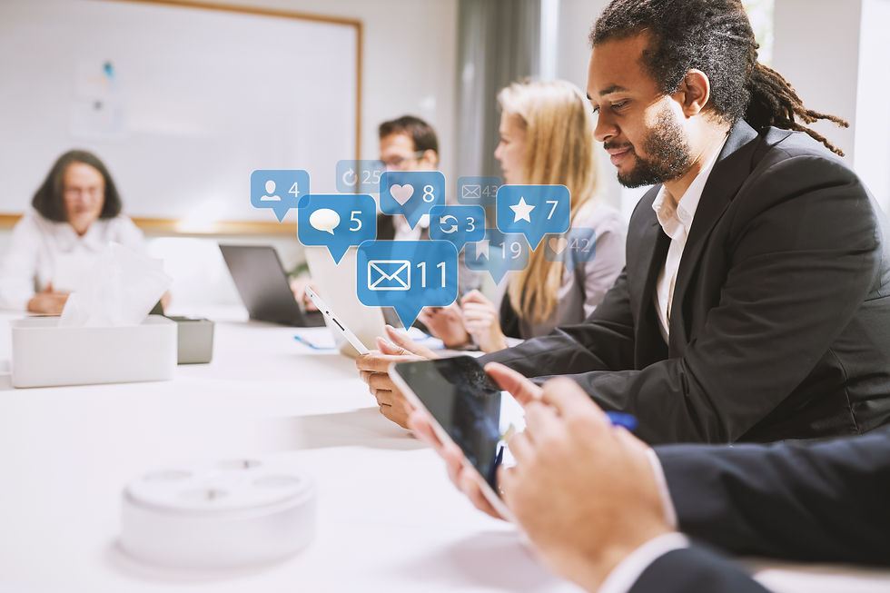 Business people in meeting distracted by social media