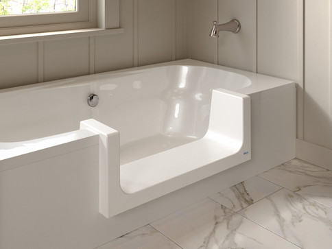 A walk-in bathtub with a low threshold for easy access, designed to enhance safety and independence in the bathroom.