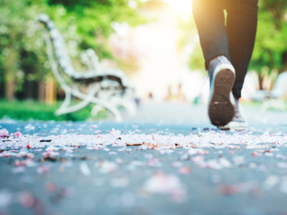 Image of person walking in a park