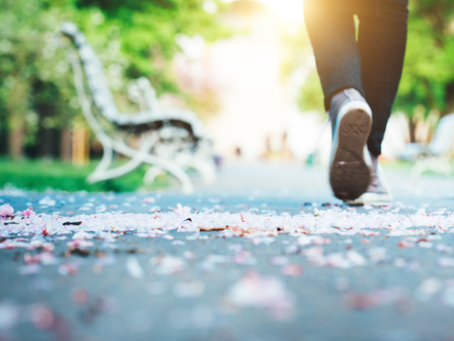 Image of person walking in a park