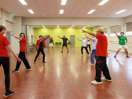 Group of older people doing Tai Chi