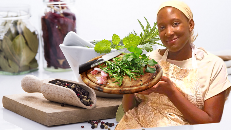 KhadiYah Preciado showing freshly harvested kitchen herbs used for herbal medicine and home apothecary