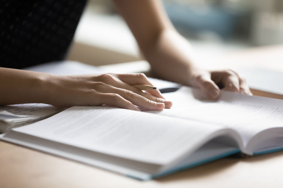 Student preparing for college test, exam, reading book