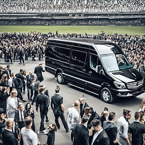 people from a stadium full of people entering a luxury black Mercedes Benz sprinter van_ed