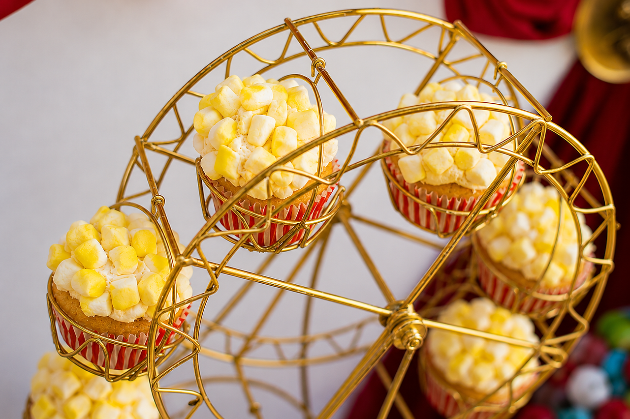 popcorn inspired cupcakes in Ferris wheel cupcake holder for vintage circus themed birthday party