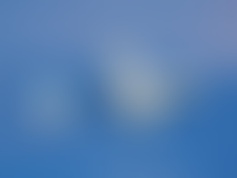 A gray drone labeled "PD-1" flies against a clear blue sky, showing text "UKRSPECSYSTEMS" on its side.