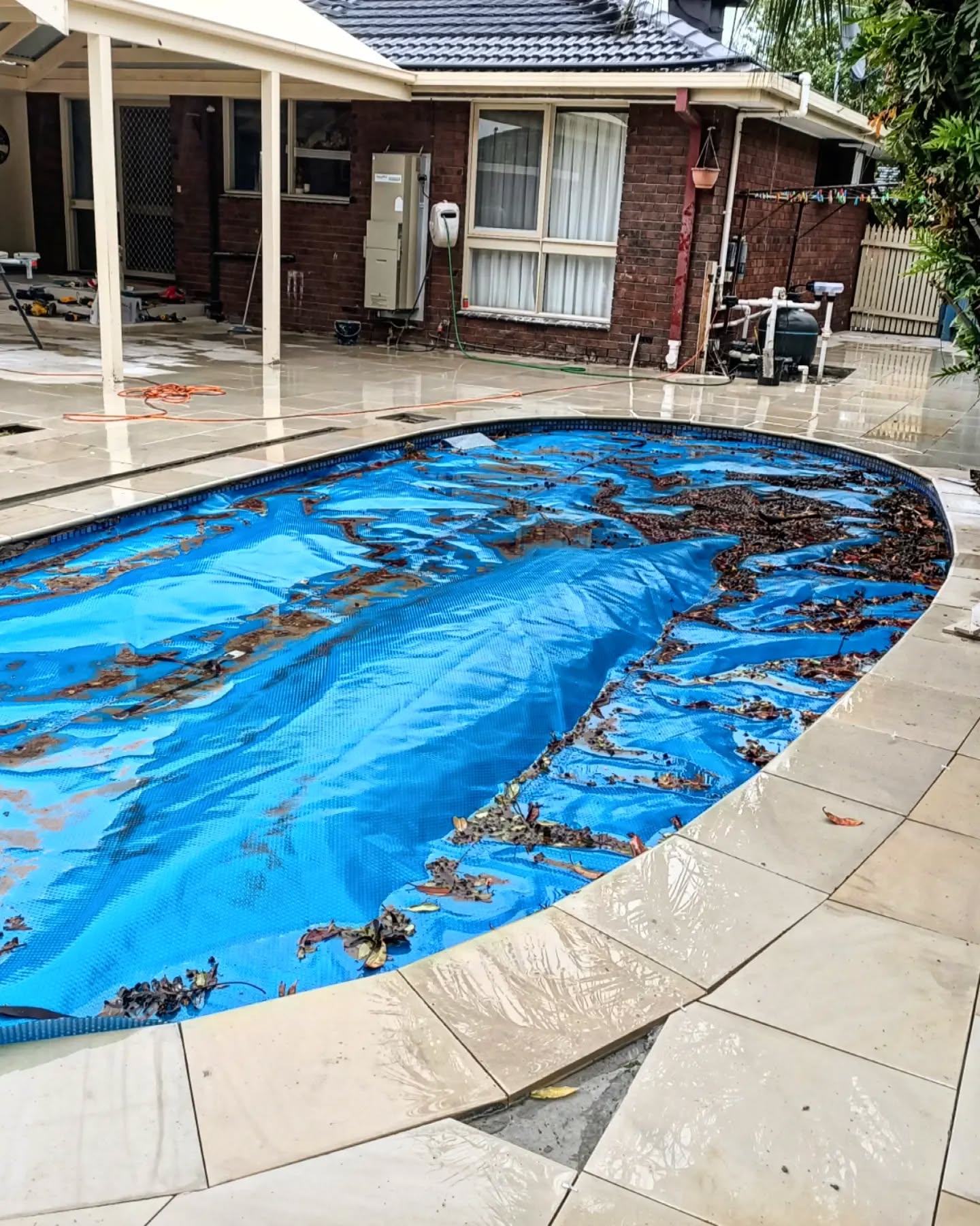 Removal of old pool tiles, laying of new concrete, installation of new pavers and coping pavers