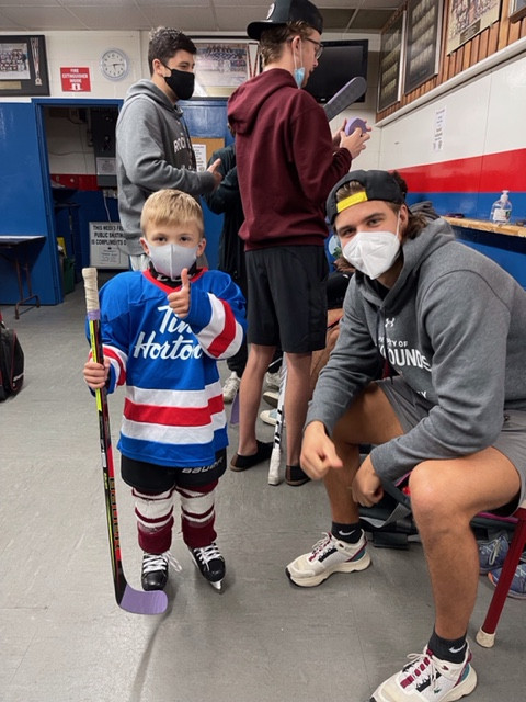 Ondrej Vaculik with small hockey player