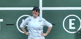 Kelly F. Lydon at Fenway Park in front of the Green Monster during her years as a catering chef, before KFL Strategies