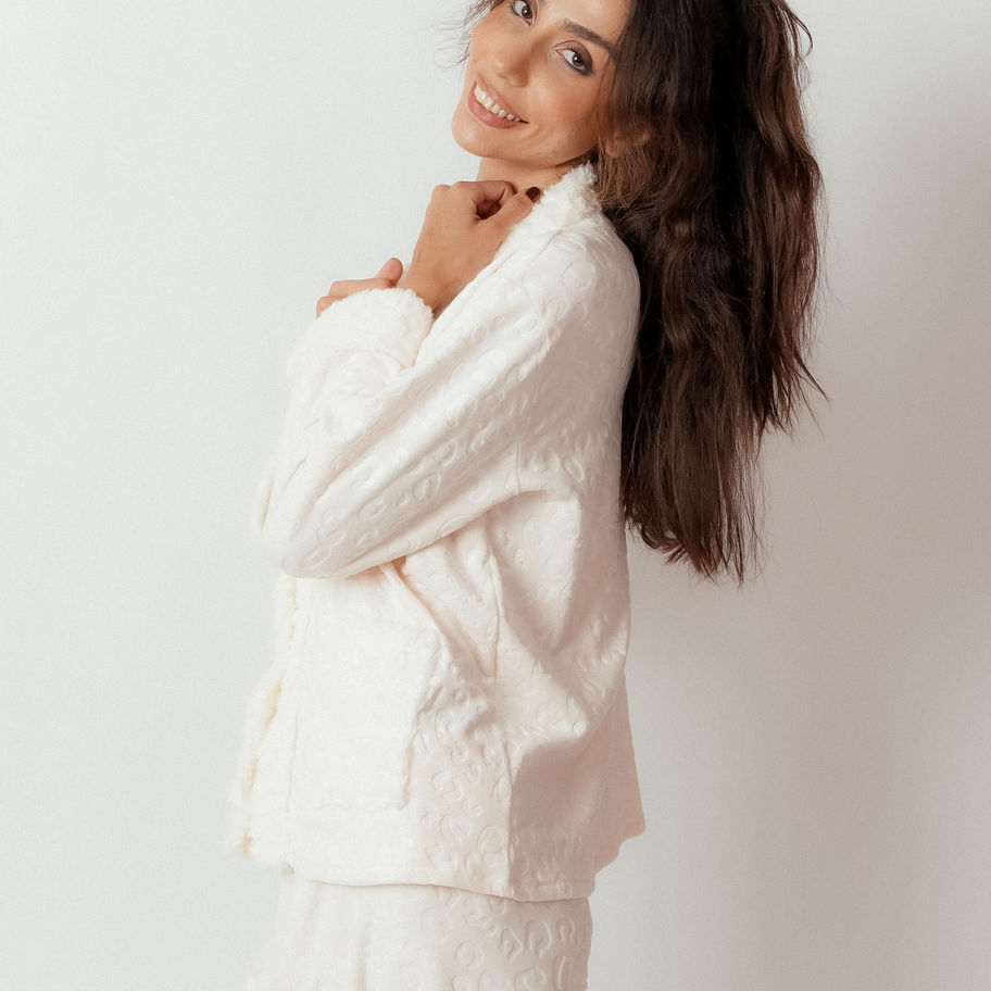 Side view of model wearing Shiny Buttons Pajama Set with faux fur accents on cuffs and pockets.
