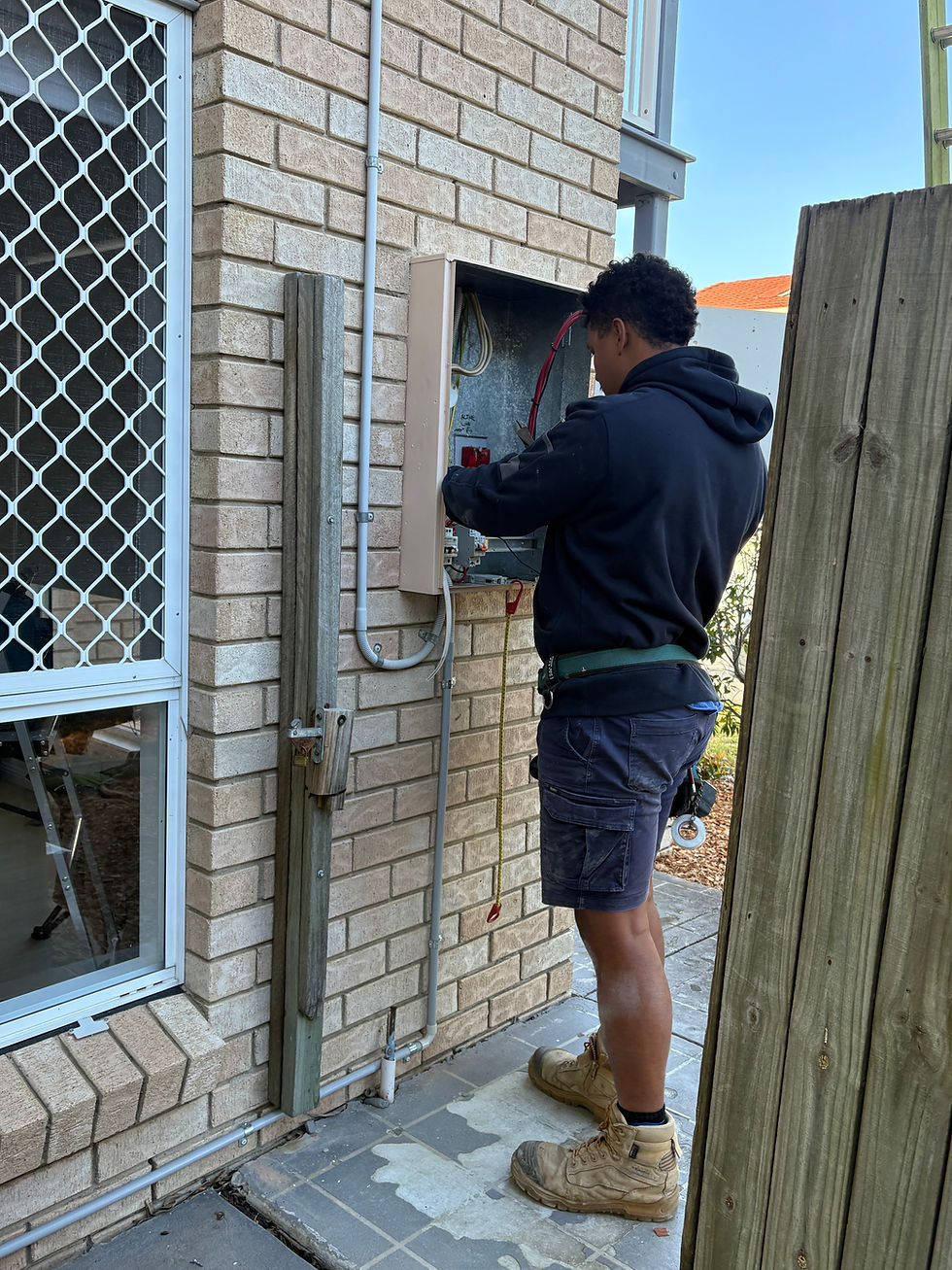 Electrician Slacks Creek working on outdoor switchboard