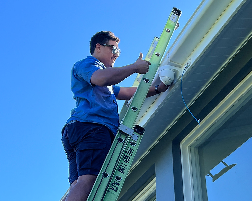 Electrician Daisy Hill installing outdoor security camera