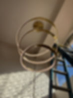 Modern gold halo chandelier installation for Our Projects