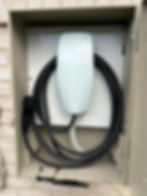 Tesla wall connector EV charger installation in a box.