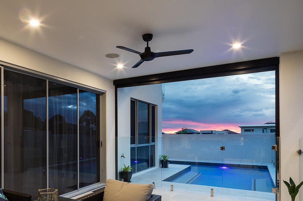 Modern patio ceiling fan installation above dining area