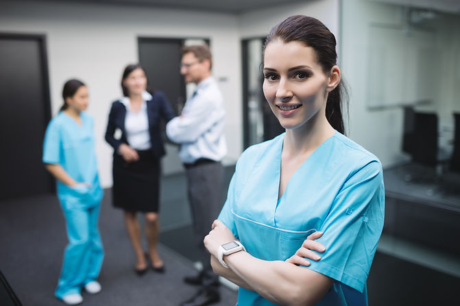 smiling-nurse-standing-with-arms-crossed.jpg