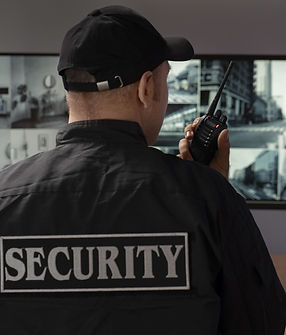 portrait-male-security-guard-with-radio-station-camera-screens-min.jpg