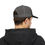 Thumbnail: back of young man wearing goddamn original white logo on black and grey trucker cap