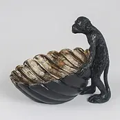 Monkey with shell dish.webp