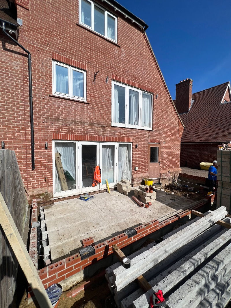 The block and beam floor is mid construction and brickwork is being done to construct the walls of the rear extension