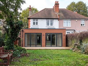 Single-storey rear extension with glazed doors opening onto a landscaped garden, built by LCCL Construction in Finchley N3