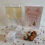 Thumbnail: Two prosecco glasses, a card, an assortment of truffles and white flower and heart gift boxes