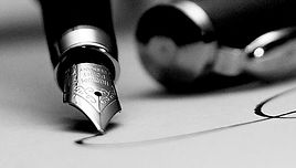 pluma-firmando.jpg