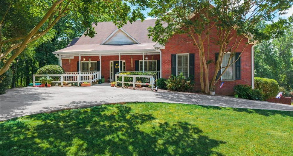 backyard with trees and brick house in Kennesaw GA