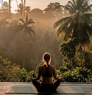 Woman meditating in nature for spiritual healing and crystal energy balance
