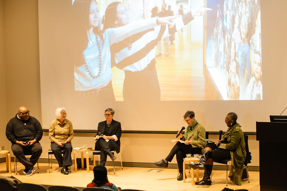 Live podcast recording in front of an audience in a lecture hall featuring three guests, 2 women and one male and 2 female co-hosts