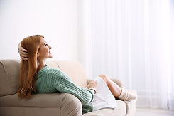 woman enjoying comfortable air in living room