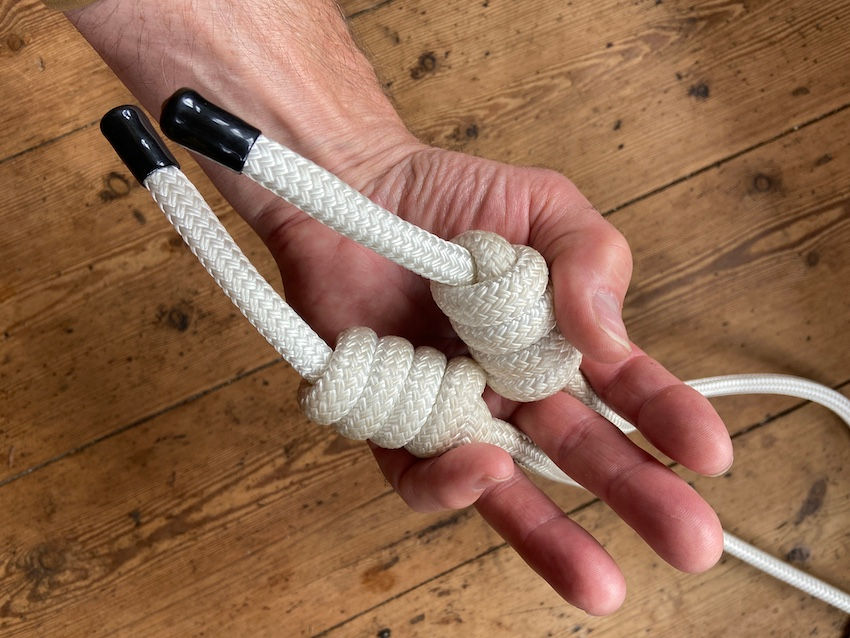 The "Grip With No Name" - both knots with thumb and pinky support.